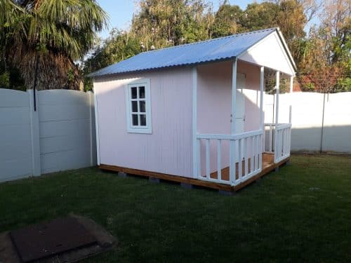 Small pink house with porch